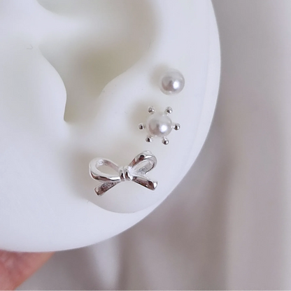 Trio aros individuales con lazo y perlas. Tope labret