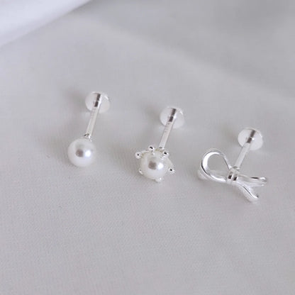 Trio aros individuales con lazo y perlas. Tope labret