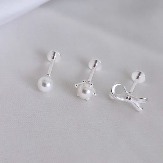 Trio aros individuales con lazo y perlas. Tope labret