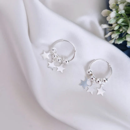 Aros argolla con esferas y estrellas