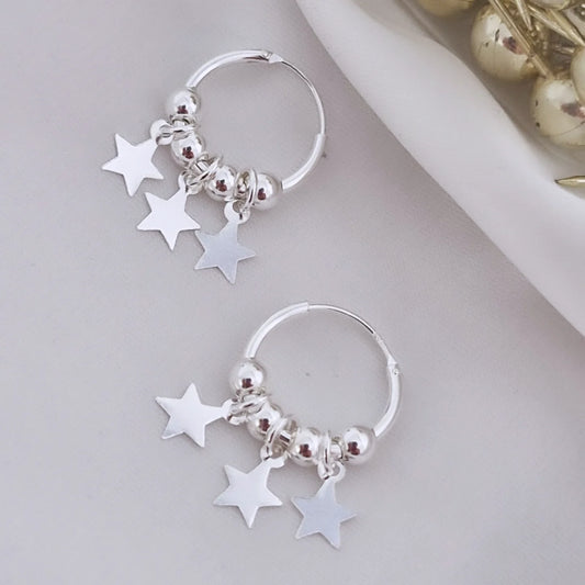 Aros argolla con esferas y estrellas